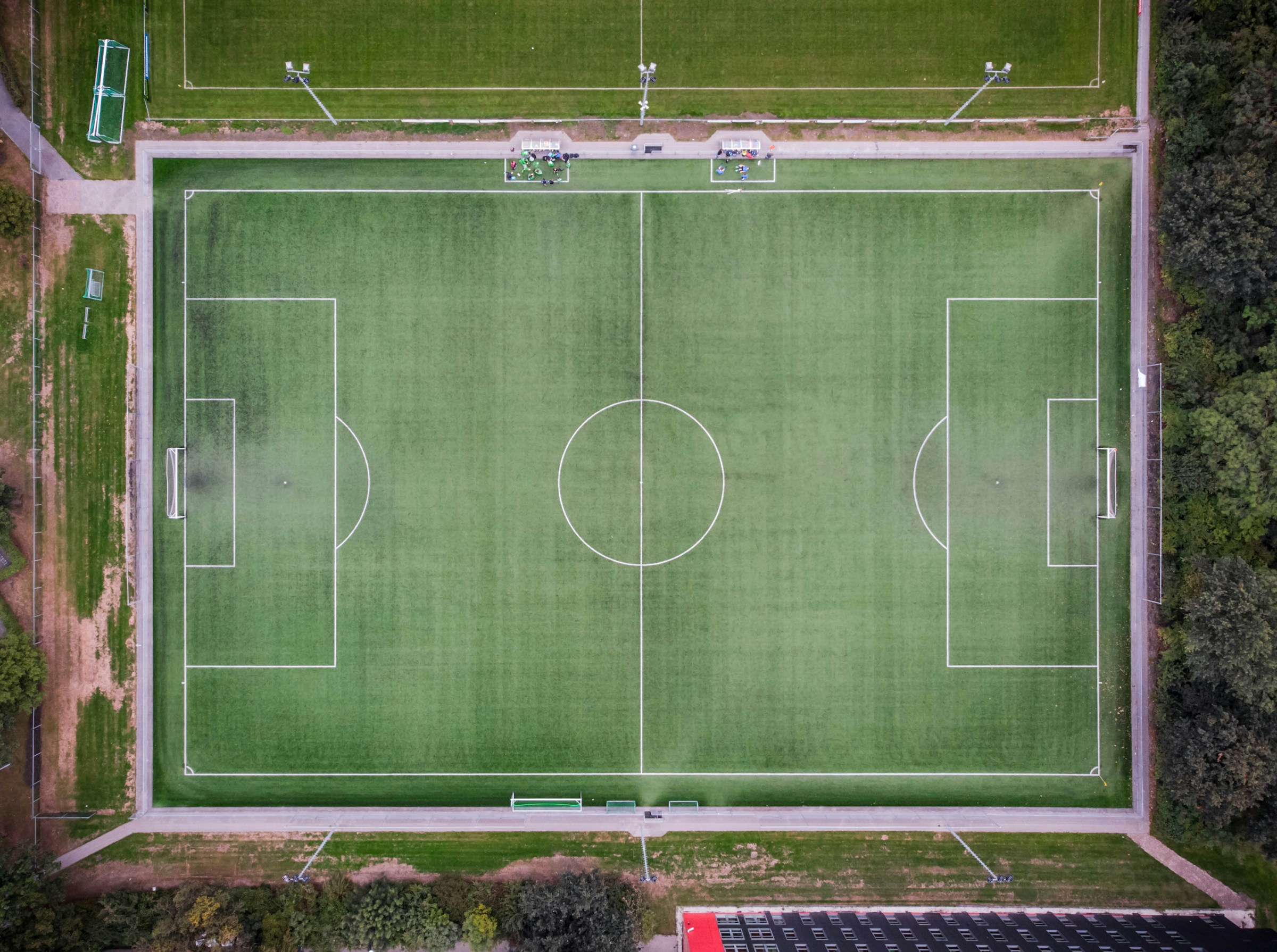 An overhead view of a green soccer pitch